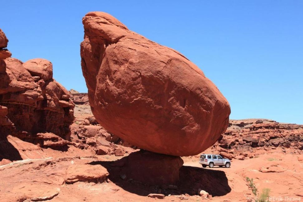 Jeep behind a rock